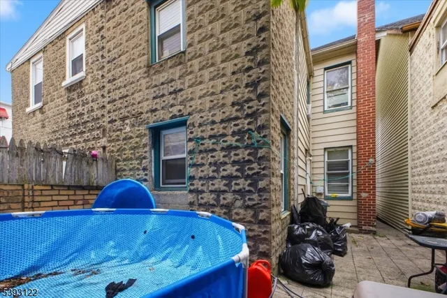 a view of a chairs and table in the balcony