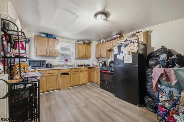 a kitchen with a refrigerator and a sink