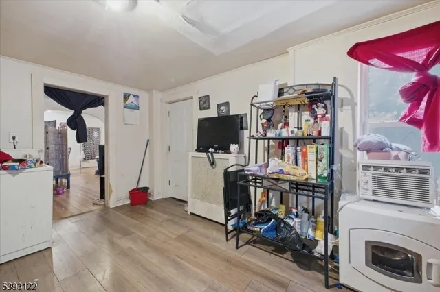 a view of a workspace with furniture and a flat screen tv