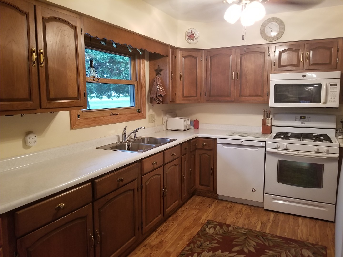 18869 Star Road Prophetstown, IL 61277 - Photo 4 of 20 a kitchen with granite countertop cabinets stainless steel appliances and a sink
