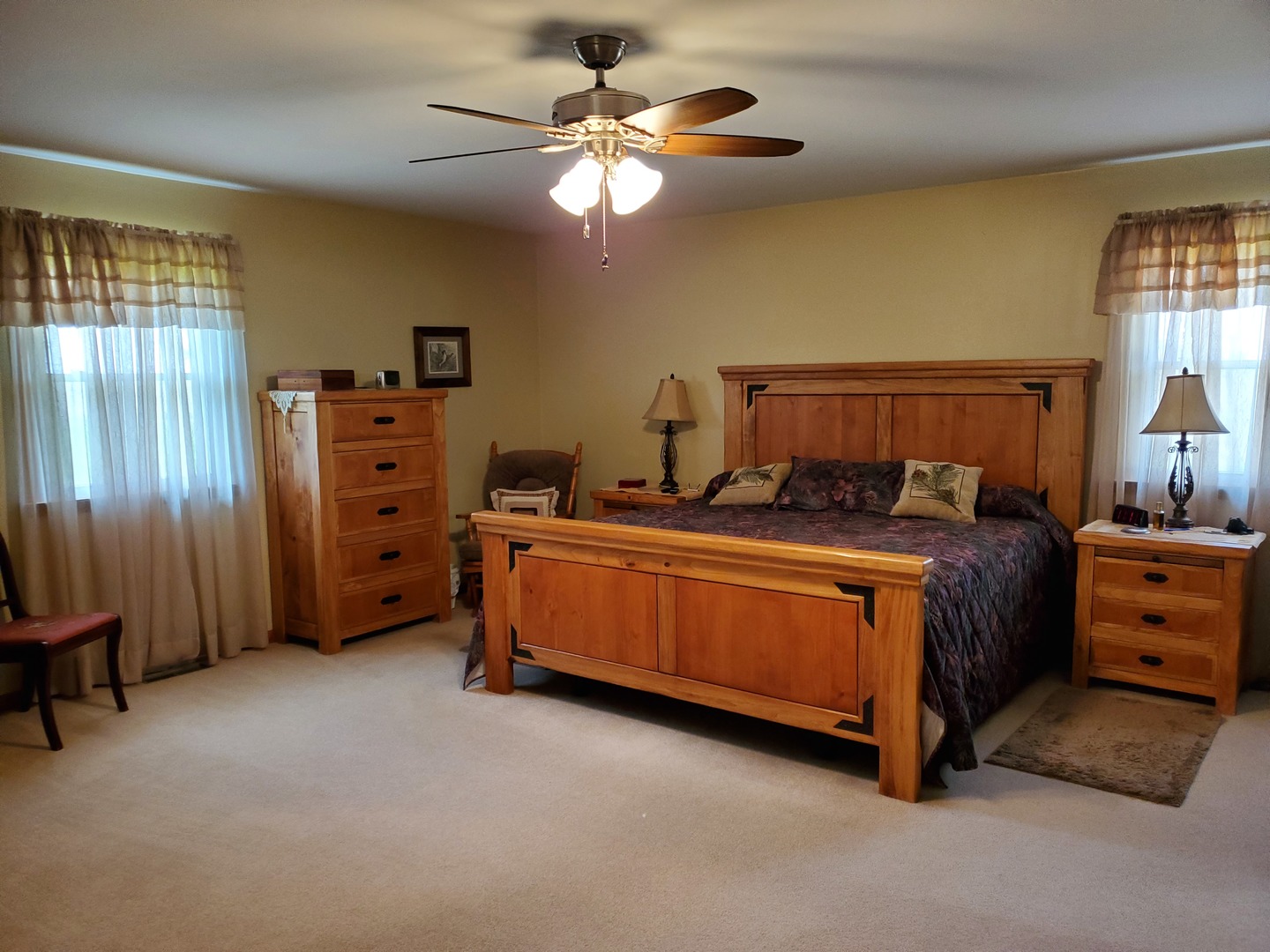 18869 Star Road Prophetstown, IL 61277 - Photo 7 of 20 a bed room with a bed and a ceiling fan