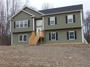 a house that has a large window in front of it