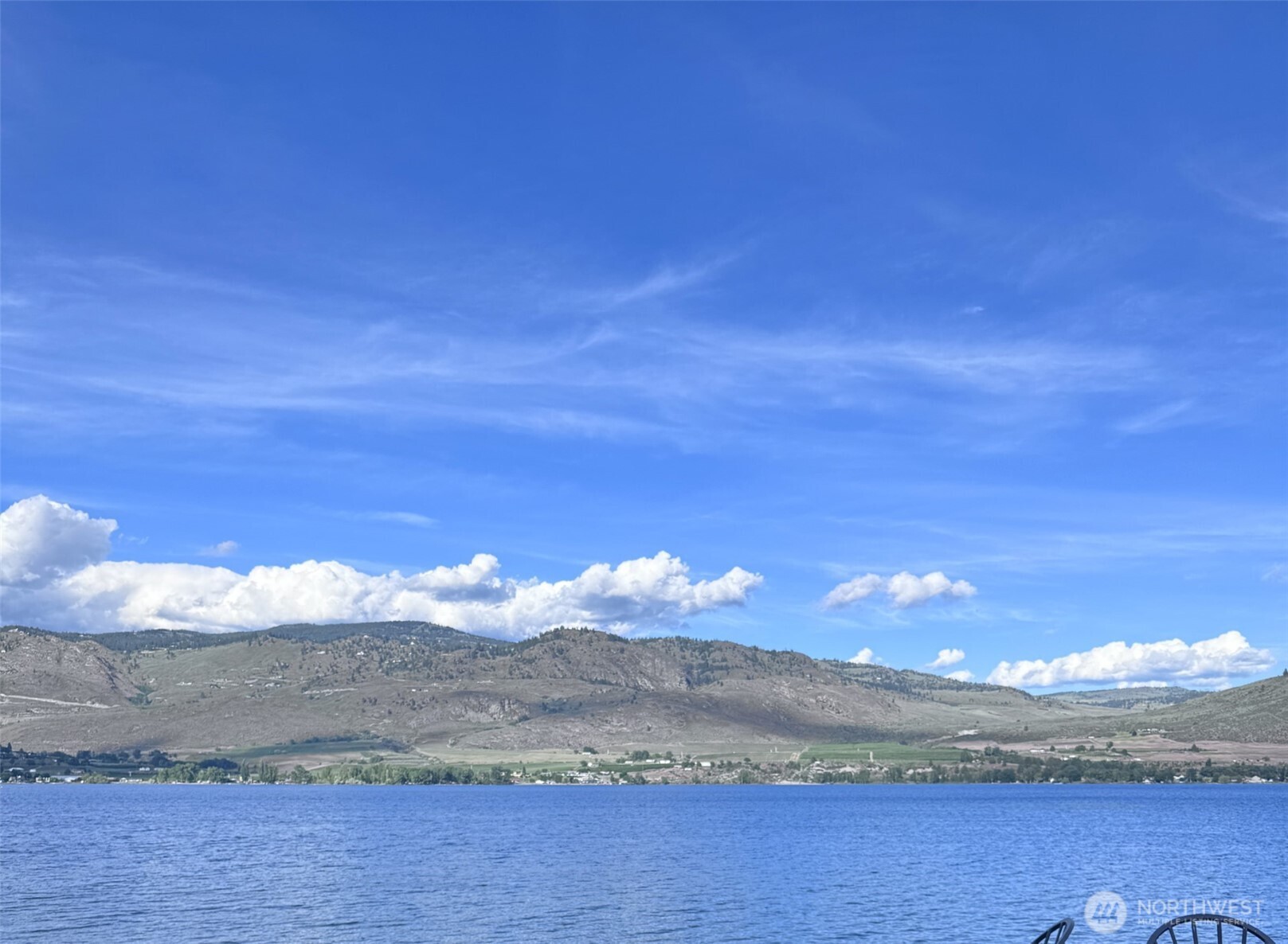 10 Turtle Lane Oroville, WA 98844 - Photo 2 of 6 a view of a lake with sunset