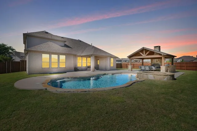 a front view of house with outdoor space and garden