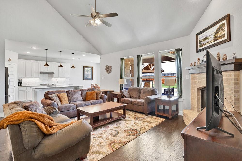2044 Longbridge Road Forney, TX 75126 - Photo 11 of 40 a living room with furniture ceiling fan and a rug