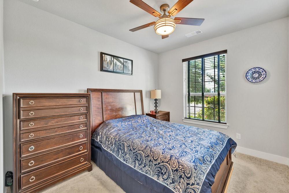 2044 Longbridge Road Forney, TX 75126 - Photo 20 of 40 a bedroom with a bed and a window