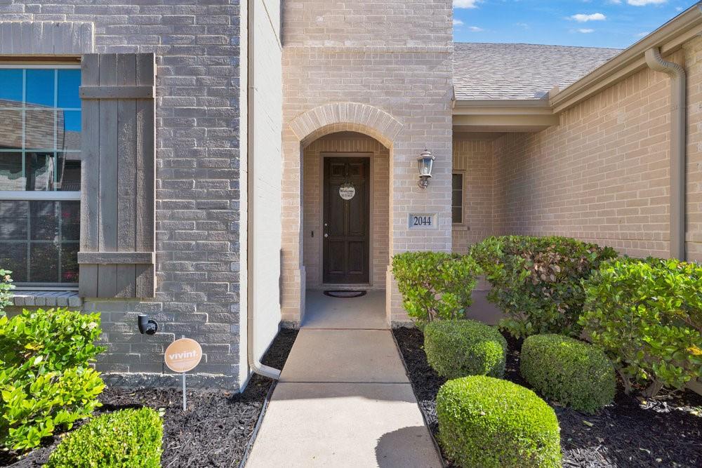 2044 Longbridge Road Forney, TX 75126 - Photo 2 of 40 a front view of a house with a garden