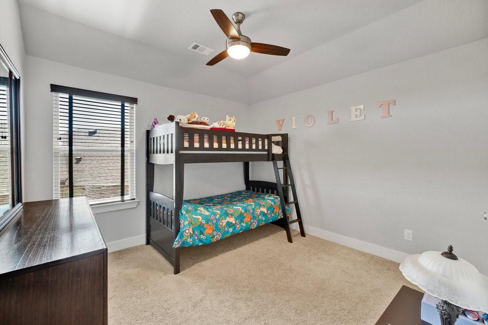 2044 Longbridge Road Forney, TX 75126 - Photo 24 of 40 a bedroom with a bed window and a table in it