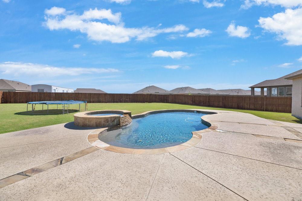 2044 Longbridge Road Forney, TX 75126 - Photo 34 of 40 a view of swimming pool with outdoor seating and yard in back