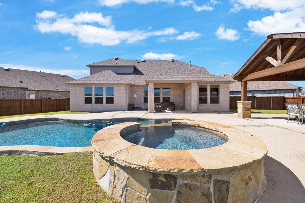 2044 Longbridge Road Forney, TX 75126 - Photo 35 of 40 a front view of a house with swimming pool