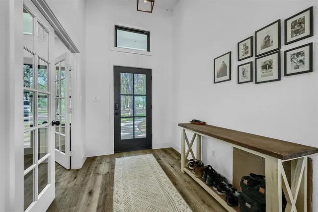 a view of a hallway with windows and stairs