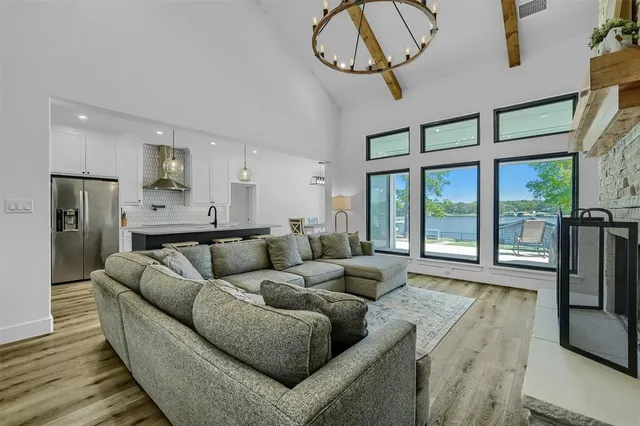 a living room with furniture and a floor to ceiling window