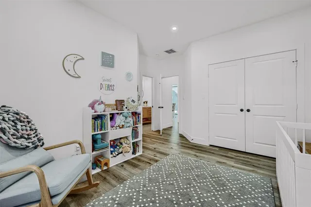 a room with furniture and a wooden floor