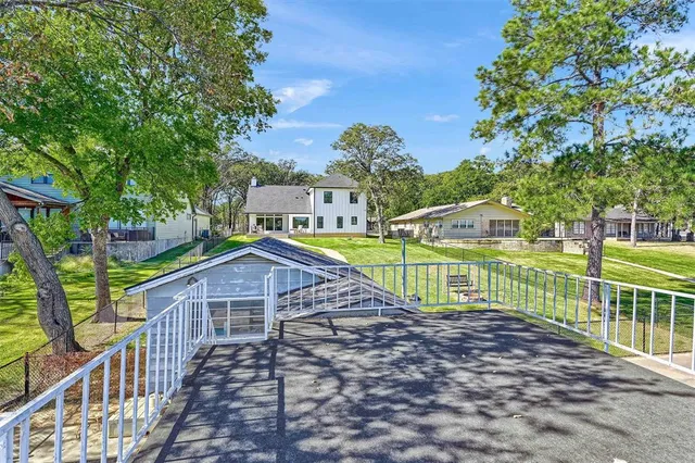 a view of a houses with a small yard