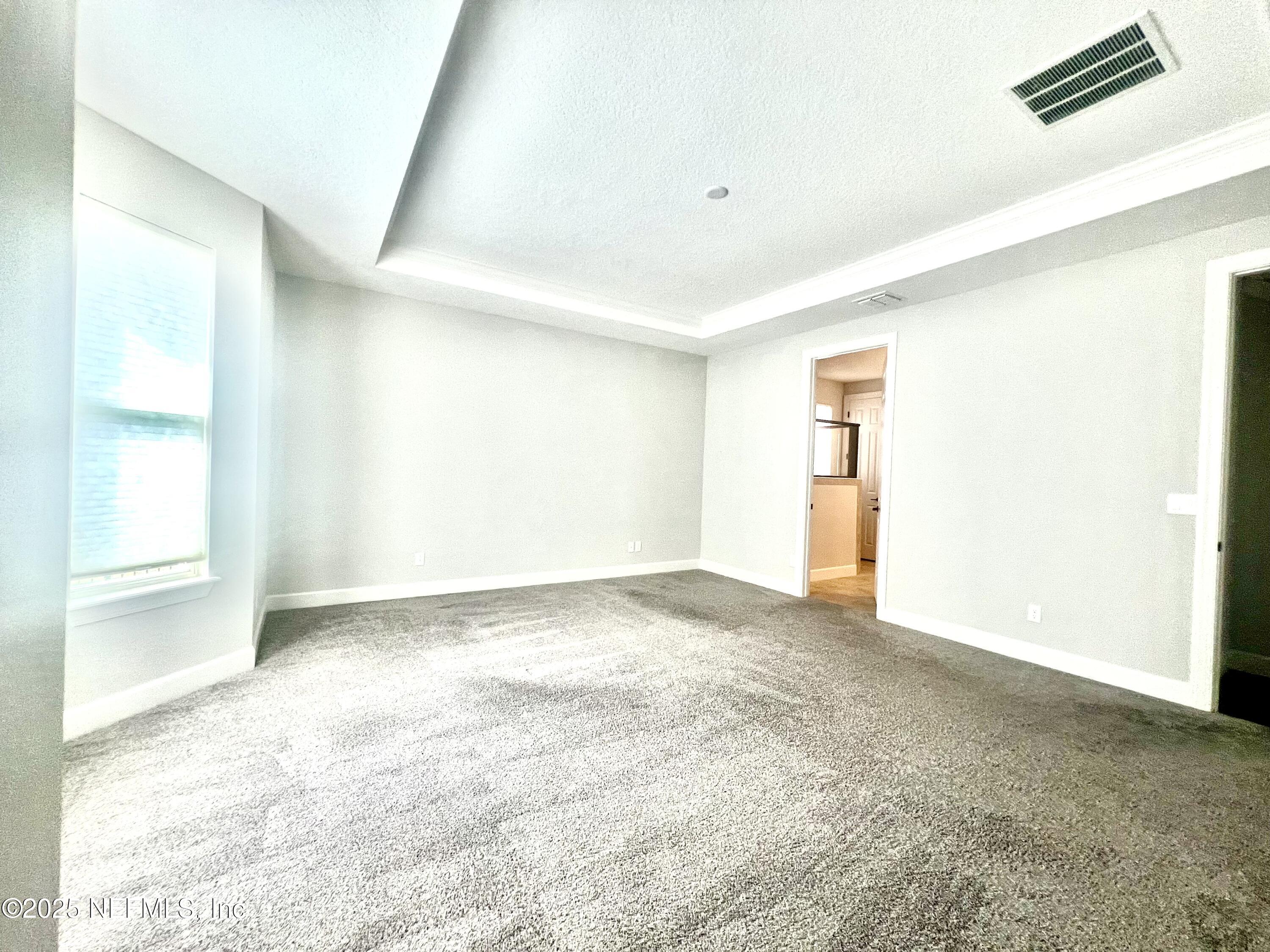 242 Orchard Lane St. Augustine, FL 32095 - Photo 16 of 44 a view of an empty room with a window