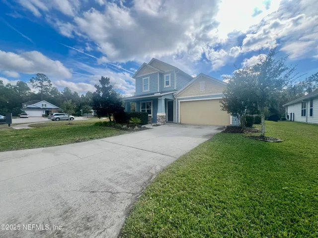 a view of a hallway with wooden floor and closet area