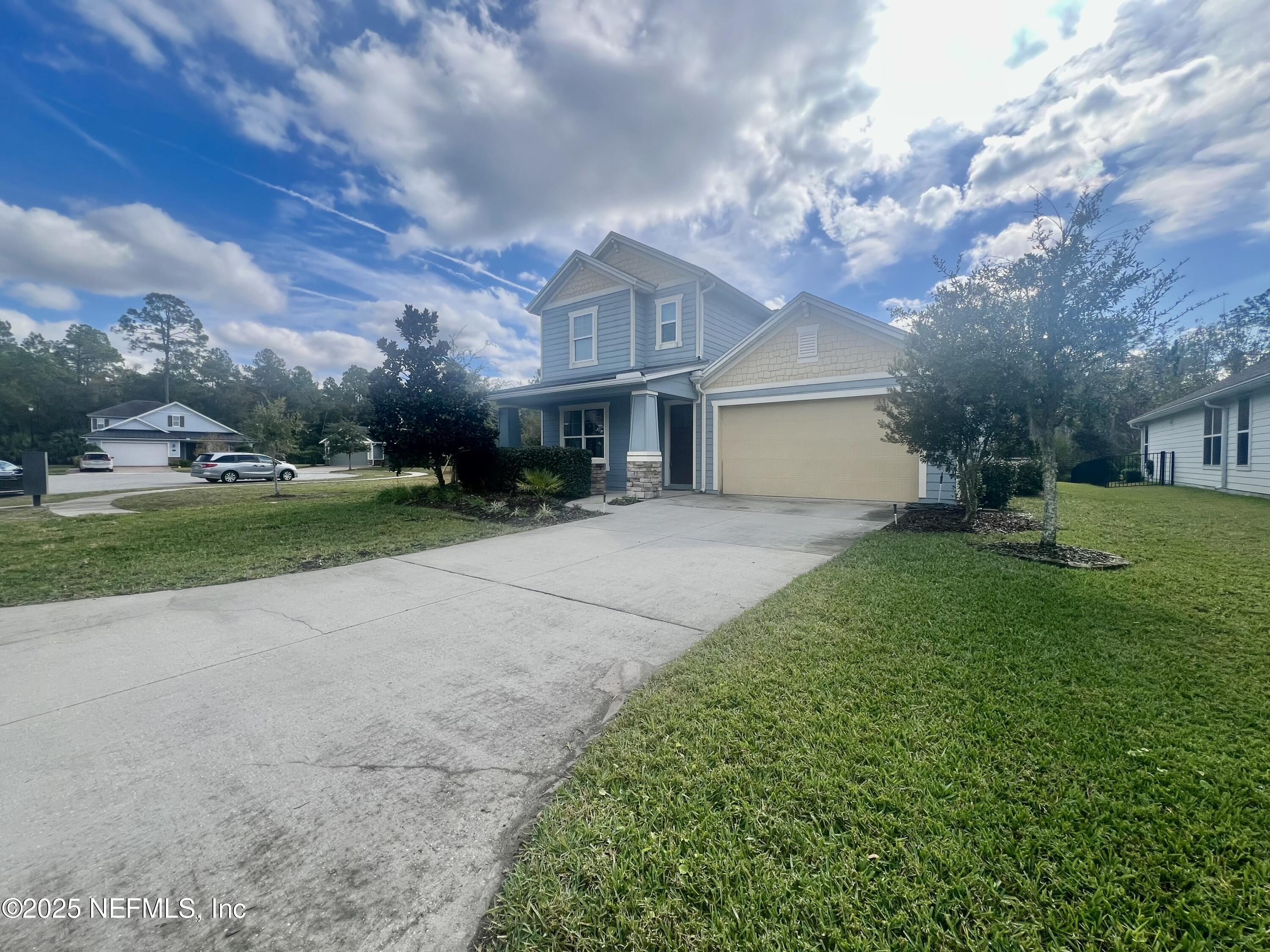 242 Orchard Lane St. Augustine, FL 32095 - Photo 3 of 44 a view of house with yard and green space