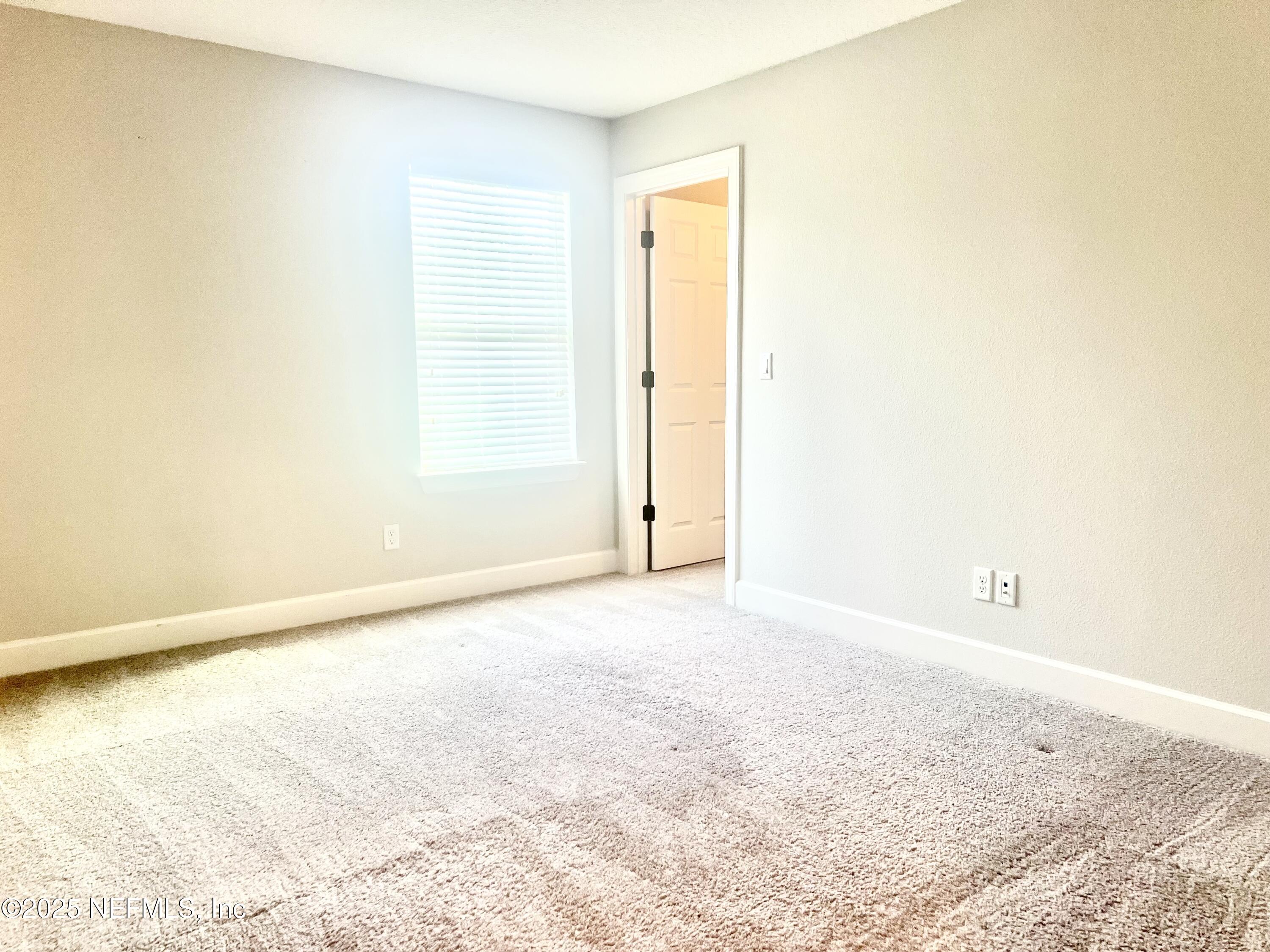 242 Orchard Lane St. Augustine, FL 32095 - Photo 35 of 44 an empty room with a natural light