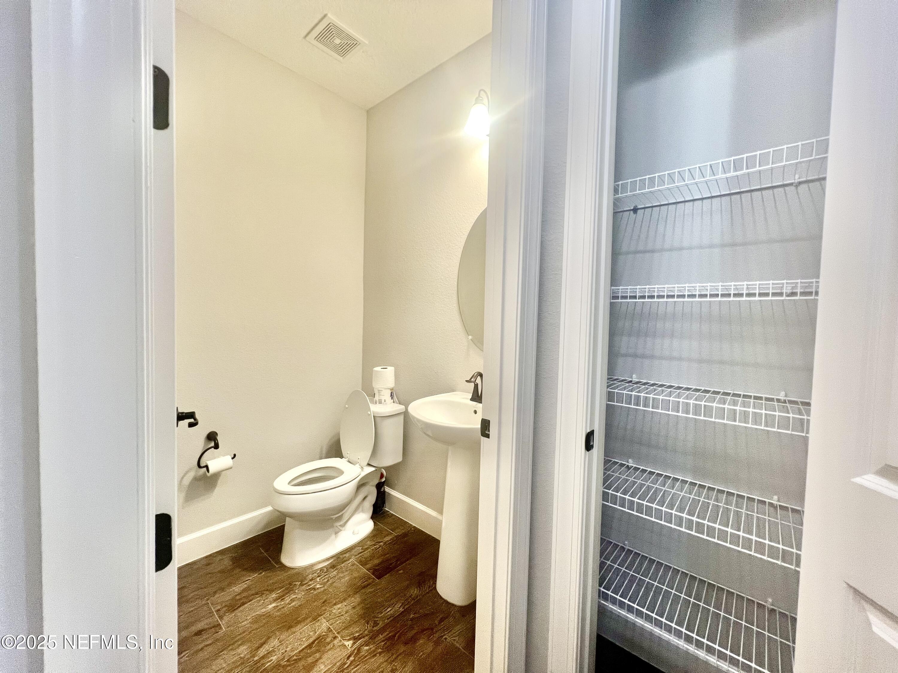 242 Orchard Lane St. Augustine, FL 32095 - Photo 7 of 44 a bathroom with a toilet and a shower