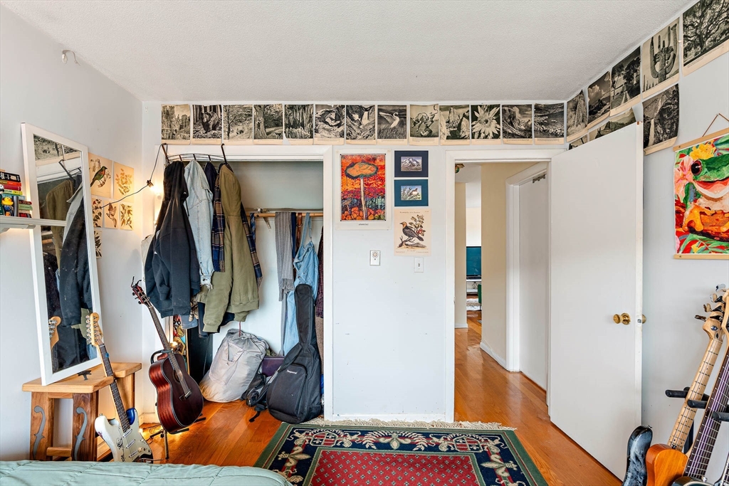 10 Scottfield Road, Unit 34 Boston, MA 02134 - Photo 14 of 19 a view of walk in closet with clothes and shoes