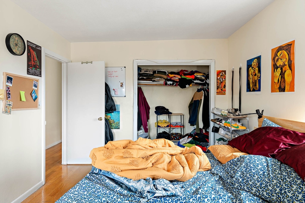 10 Scottfield Road, Unit 34 Boston, MA 02134 - Photo 17 of 19 a bedroom with bed and a window