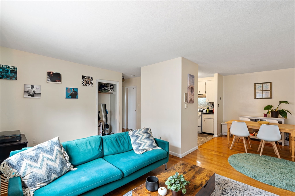 10 Scottfield Road, Unit 34 Boston, MA 02134 - Photo 18 of 19 a living room with furniture and a table
