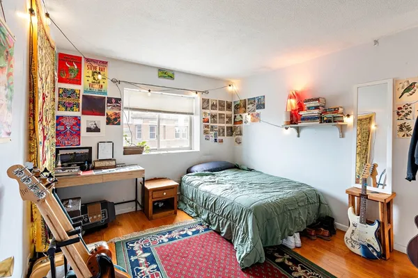 a bedroom with furniture and a bed