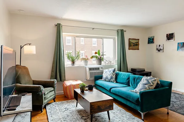 a living room with furniture and a window