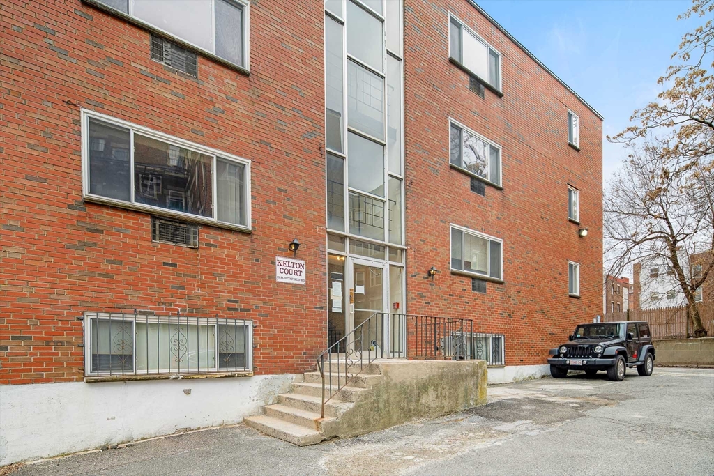 10 Scottfield Road, Unit 34 Boston, MA 02134 - Photo 5 of 19 a car parked in front of a brick building