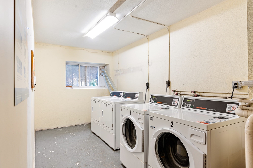 10 Scottfield Road, Unit 34 Boston, MA 02134 - Photo 8 of 19 a view of washer and dryer with bathroom in the background