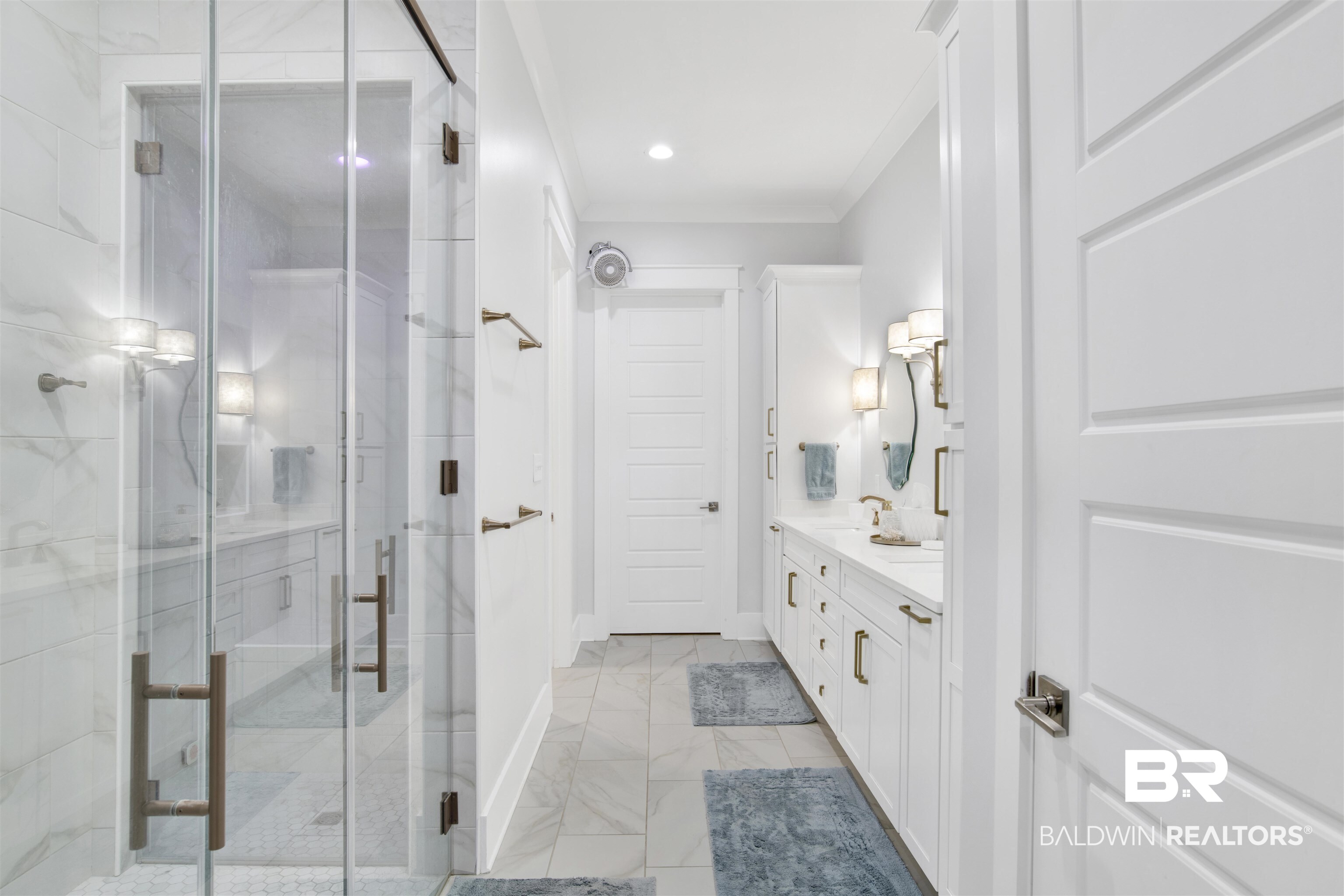 32937 River Road Orange Beach, AL 36561 - Photo 20 of 42 Bathroom featuring vanity, a shower with shower door, and ornamental molding
