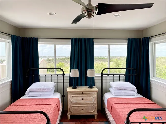 a bed room with a bed and a window