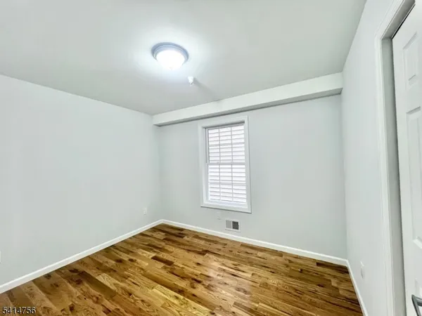 a view of a bedroom with a window