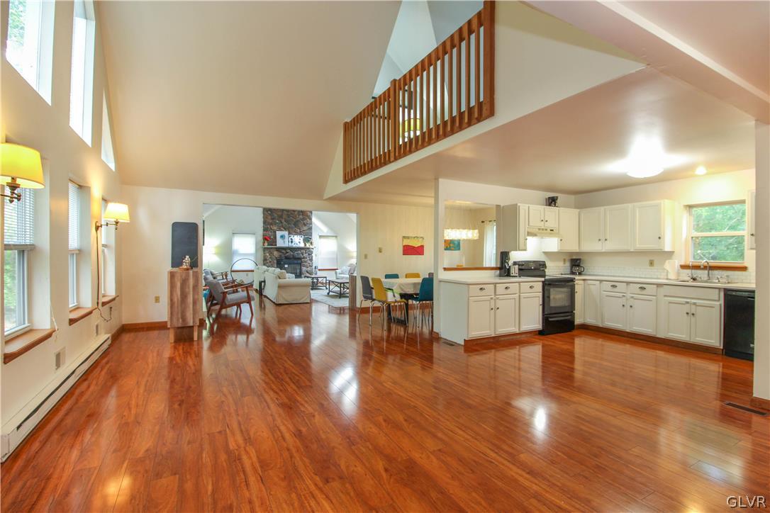 4219 Winchester Way Bushkill, PA 18324 - Photo 11 of 49 a kitchen with white cabinets and counter space