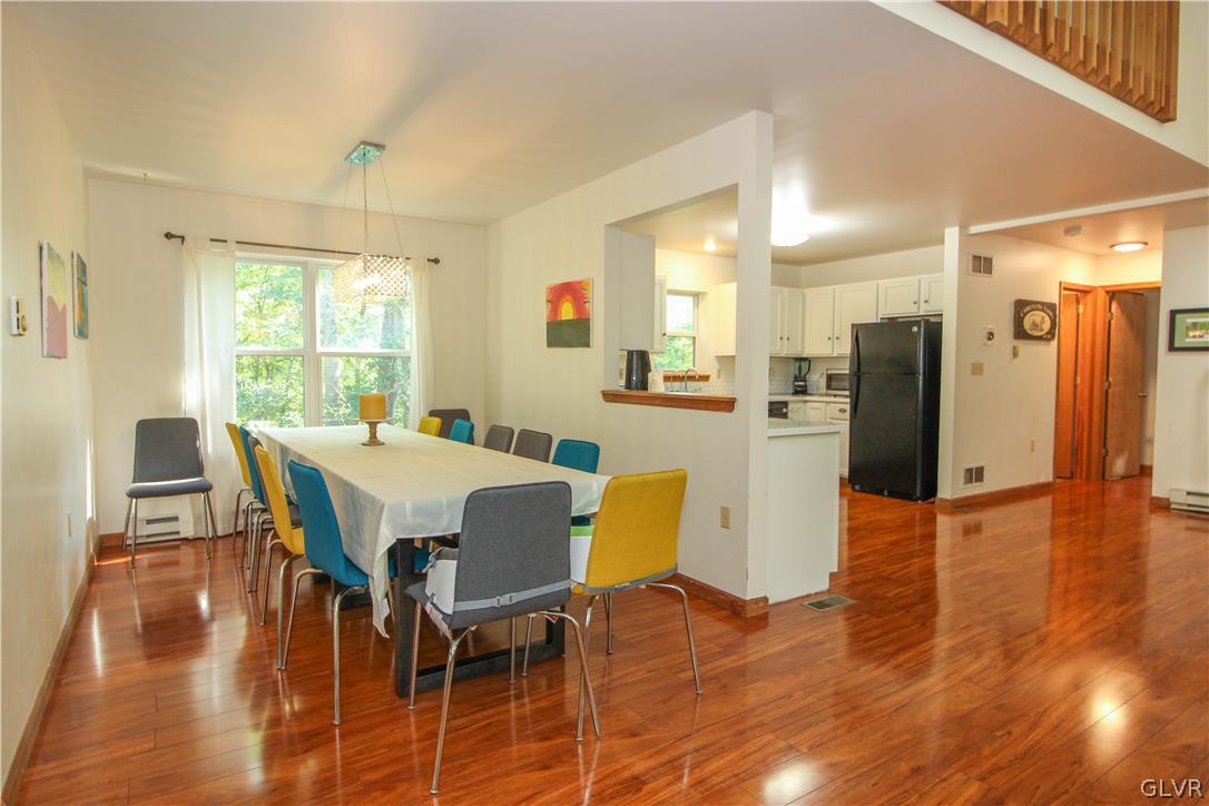 4219 Winchester Way Bushkill, PA 18324 - Photo 14 of 49 a view of a dining room with furniture and wooden floor