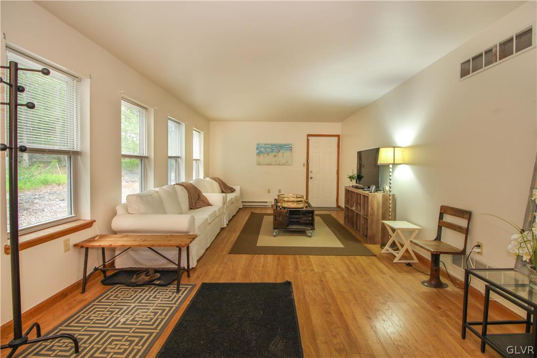 4219 Winchester Way Bushkill, PA 18324 - Photo 23 of 49 a living room with furniture and a table