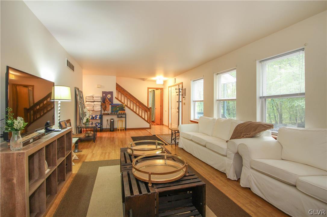 4219 Winchester Way Bushkill, PA 18324 - Photo 24 of 49 a living room with furniture and a flat screen tv