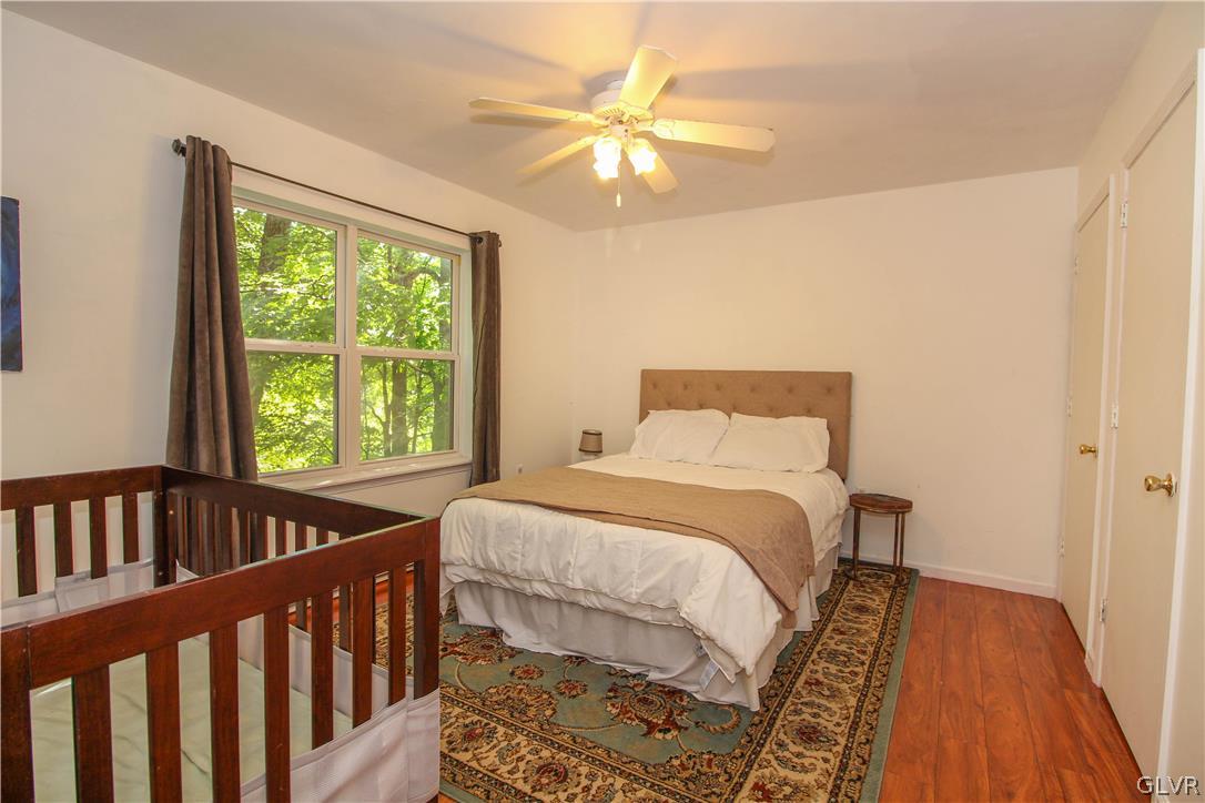 4219 Winchester Way Bushkill, PA 18324 - Photo 27 of 49 a bedroom with a bed and a window