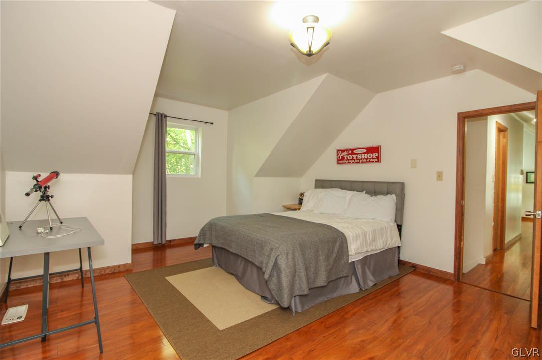 4219 Winchester Way Bushkill, PA 18324 - Photo 32 of 49 a bedroom with a bed and a table in it