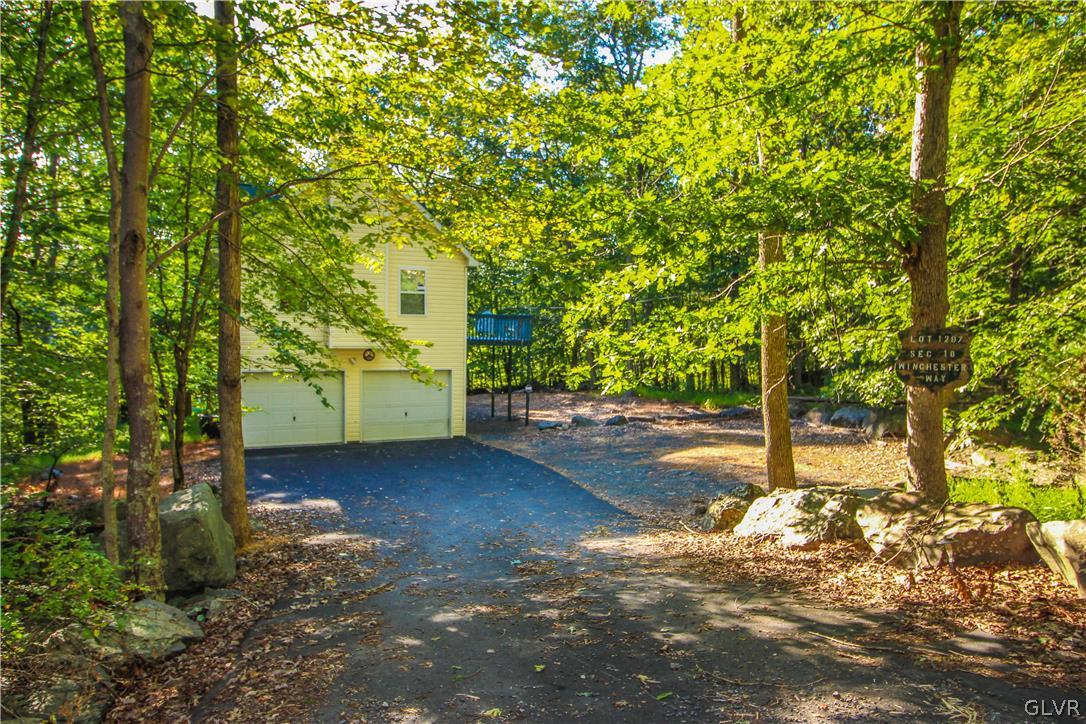 4219 Winchester Way Bushkill, PA 18324 - Photo 41 of 49 a view of a yard with plants and trees