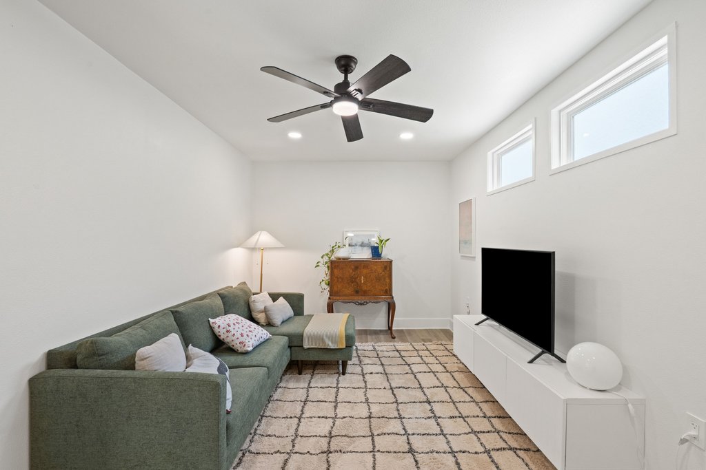 4705 Old Castle Road Austin, TX 78745 - Photo 17 of 32 The converted garage adds a true bonus room, perfect as a second lounge, office, workout space, or a guest room.