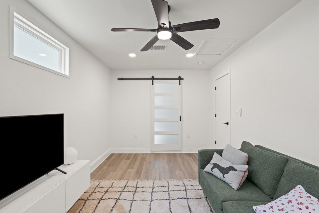 4705 Old Castle Road Austin, TX 78745 - Photo 18 of 32 A modern sliding barn door lets you close it off for privacy.