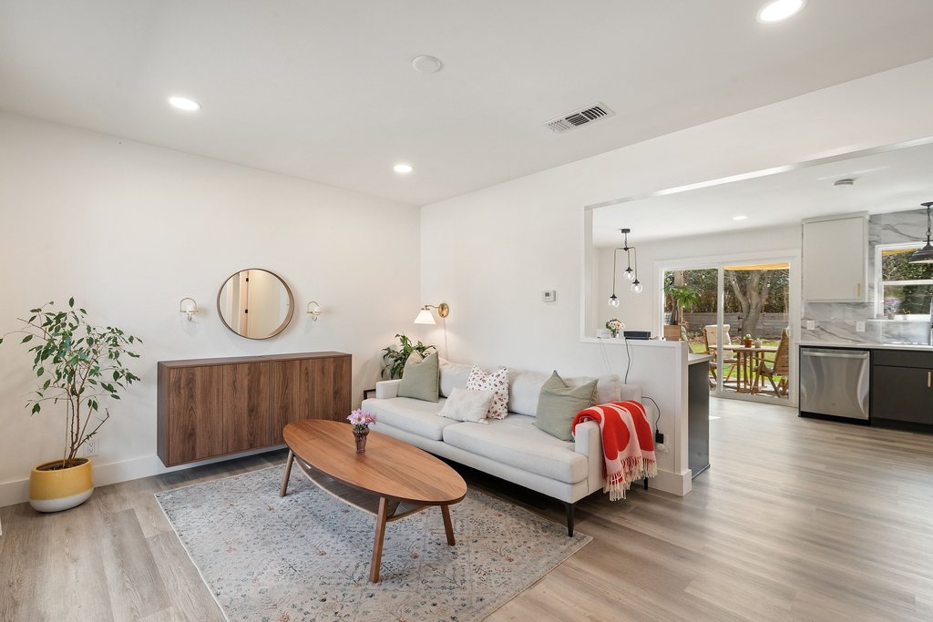 4705 Old Castle Road Austin, TX 78745 - Photo 2 of 32 The layout is open and inviting, with the kitchen, living, and dining connected in a way that feels bright and natural.