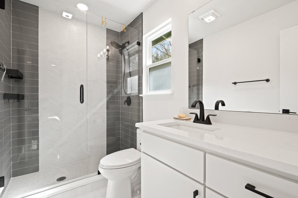 4705 Old Castle Road Austin, TX 78745 - Photo 21 of 32 The ensuite bathroom gives serious spa-vibes!