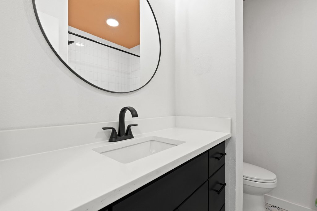 4705 Old Castle Road Austin, TX 78745 - Photo 25 of 32 Another stylish full bath sits near the secondary bedrooms.