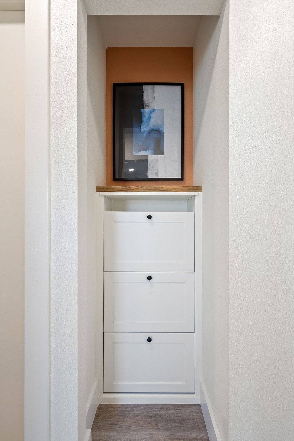 4705 Old Castle Road Austin, TX 78745 - Photo 26 of 32 This built-in nook doubles as a mini mudroom, perfect for keeping shoes and bags tucked away.