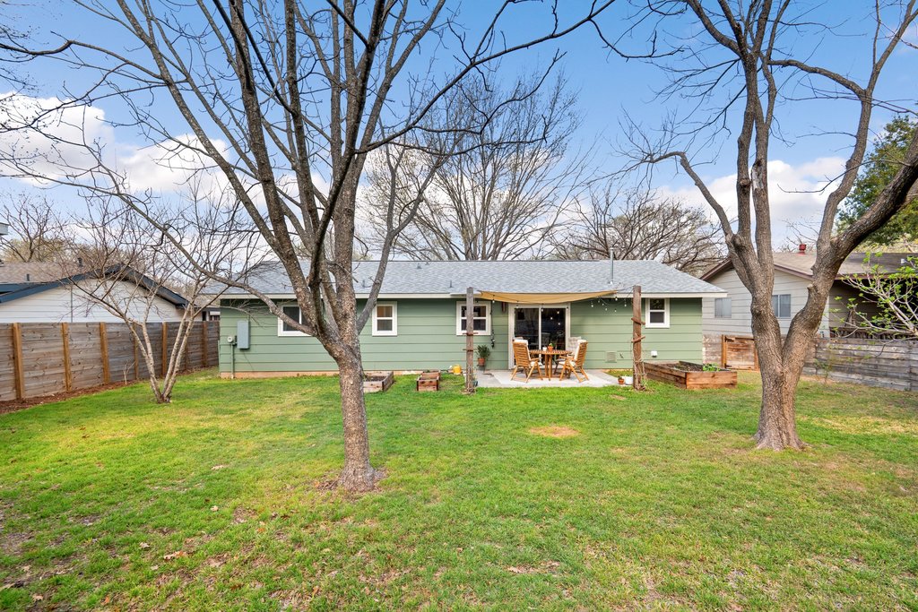 4705 Old Castle Road Austin, TX 78745 - Photo 31 of 32 When the trees are in bloom you have a nice shaded area for play.