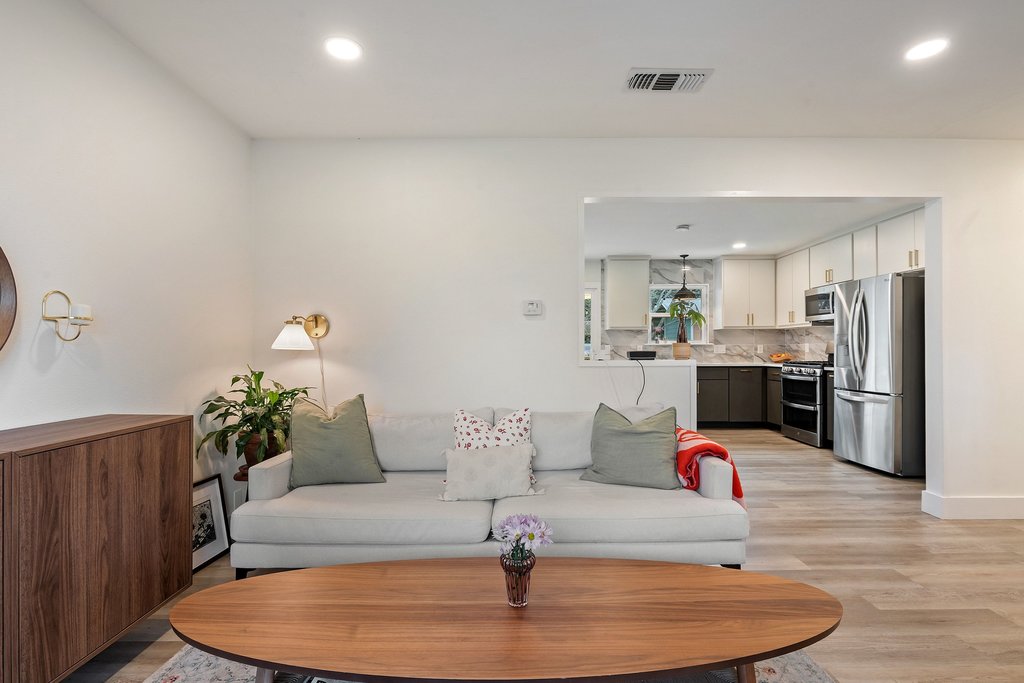 4705 Old Castle Road Austin, TX 78745 - Photo 9 of 32 A layout that keeps everyone connected, with sightlines straight into the kitchen for easy hosting.
