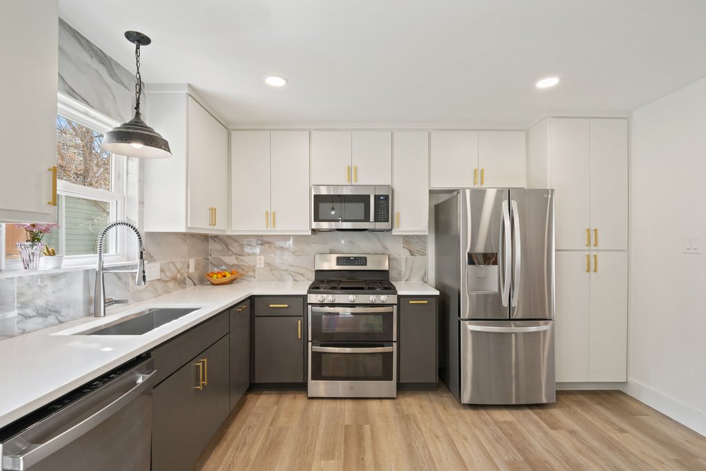 4705 Old Castle Road Austin, TX 78745 - Photo 10 of 32 The kitchen features modern, flat-front soft-close cabinetry.