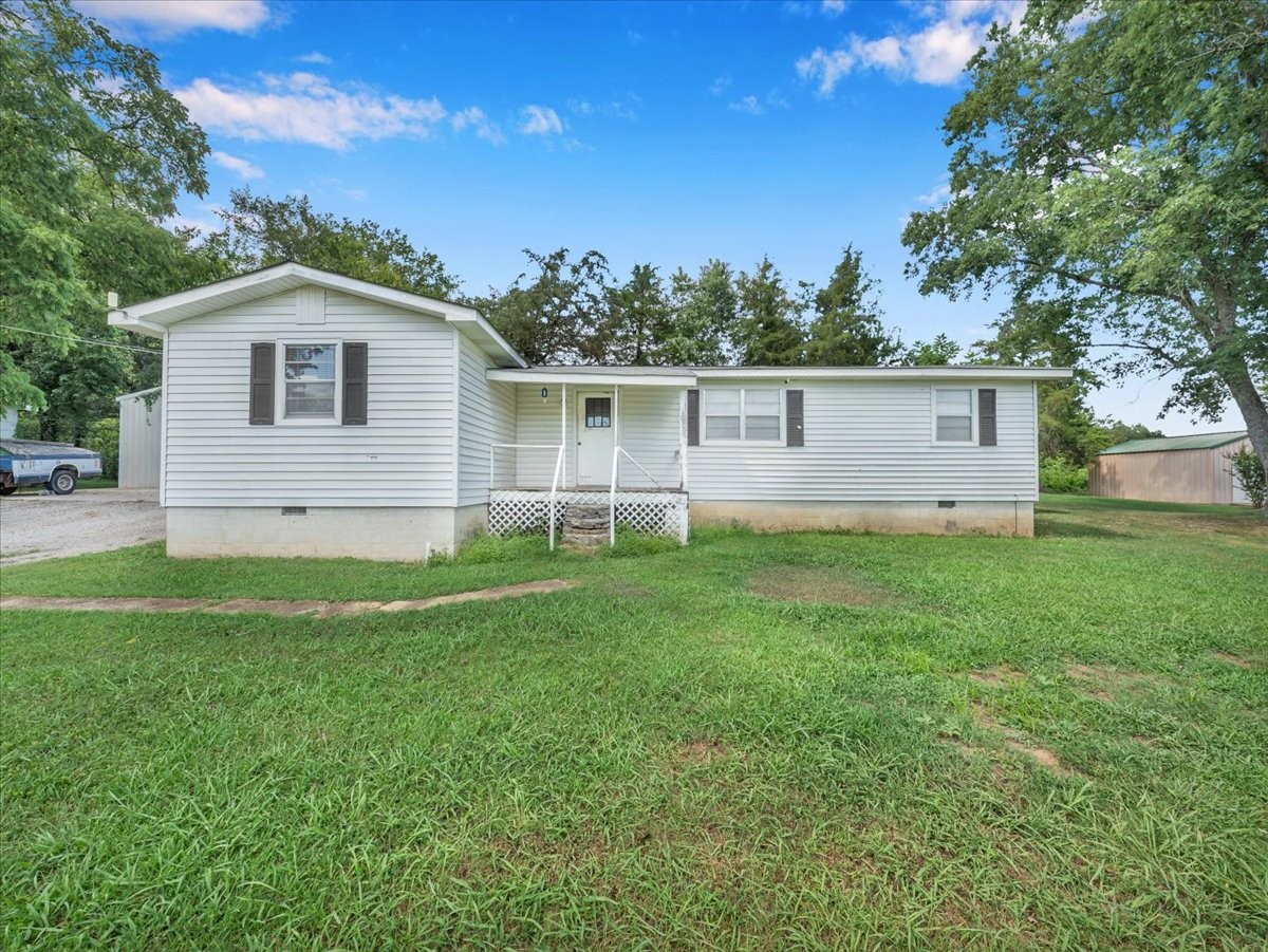 707 Molino Road Taft, TN 38488 - Photo 1 of 28 a front view of house with yard and green space